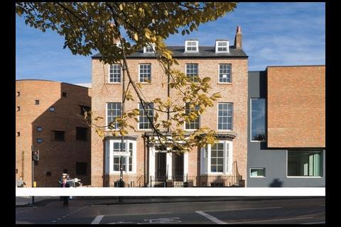 A pair of listed Georgian houses has been sandwiched between new curved and rectilinear wings